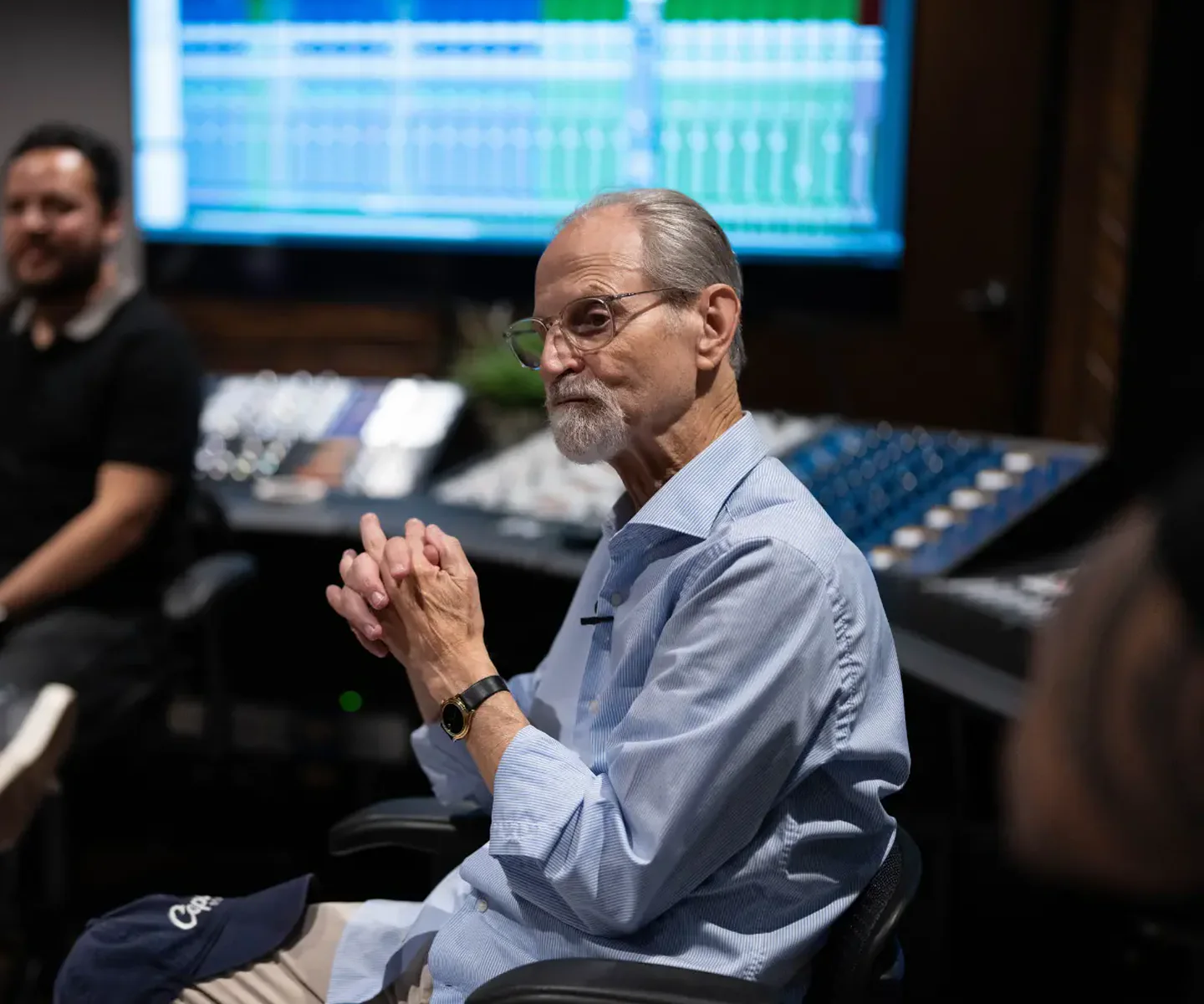 Eddie Kramer speaking with participants in an Austin recording studio